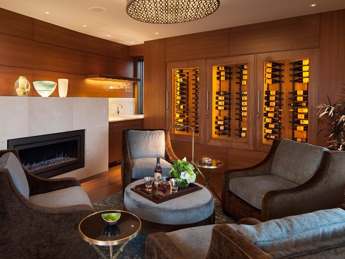 A living room with a fireplace and a wine cellar