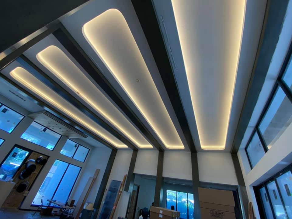 A large room with a ceiling that has a lot of lights on it