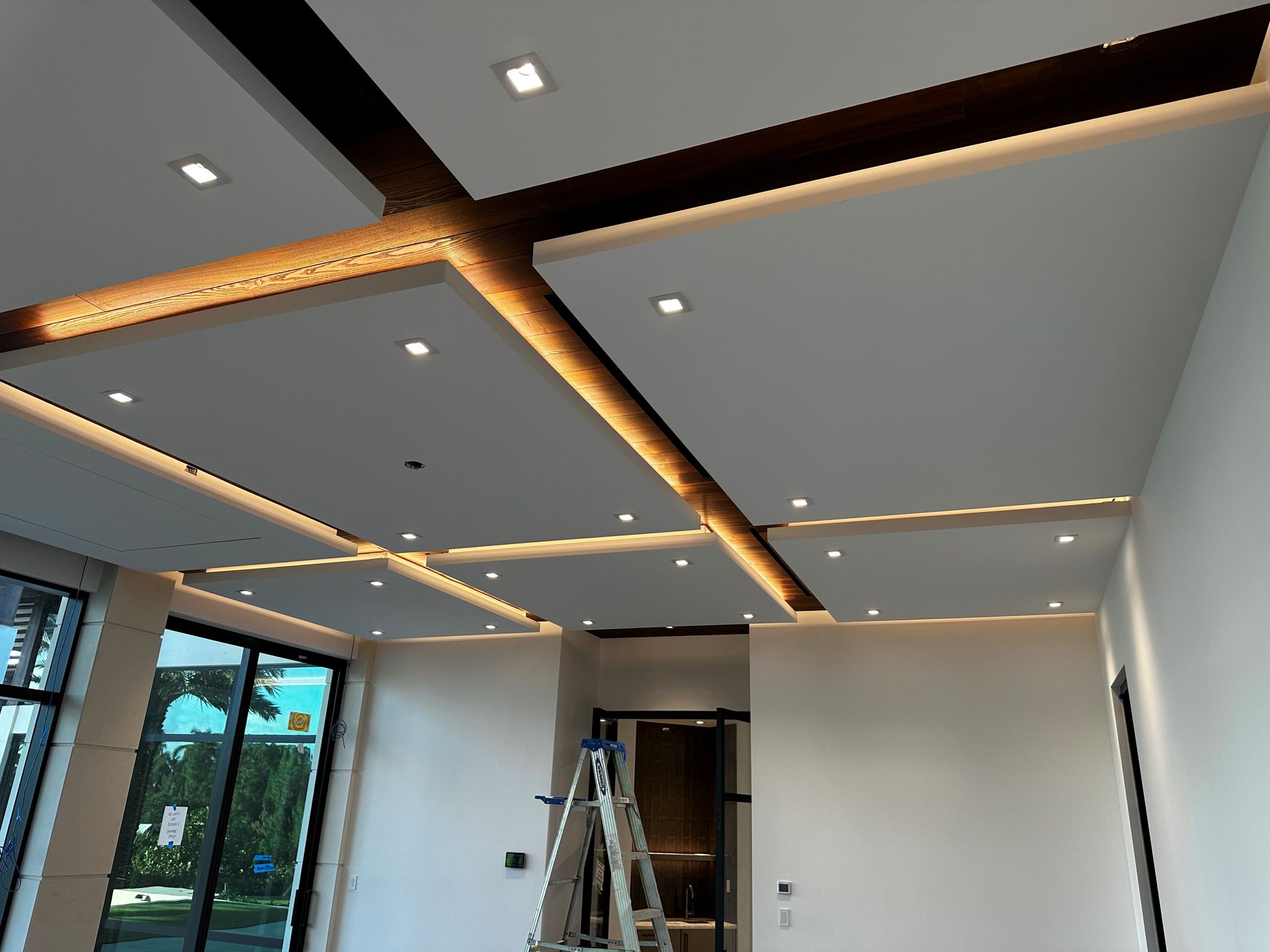 A room with a ceiling that has a lot of lights on it