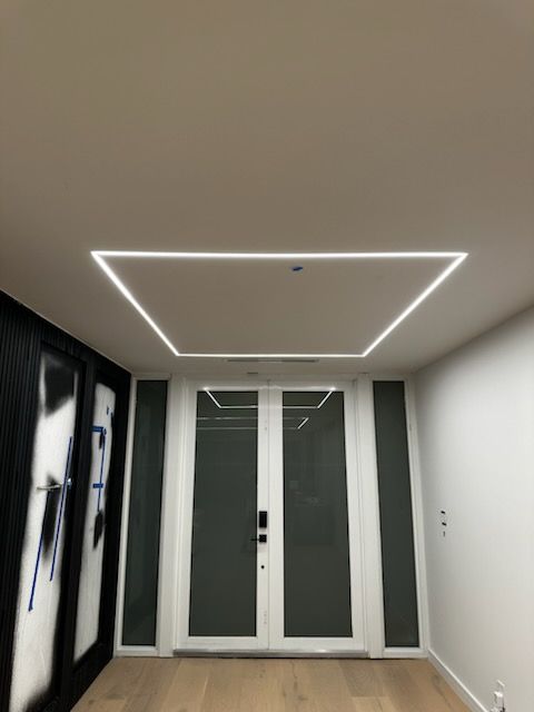 A hallway with a square light on the ceiling