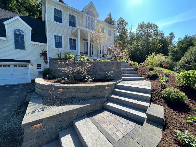 A large house with stairs leading up to it.