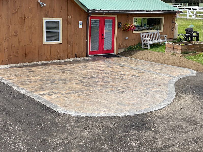 A house with a red door and a bench in front of it