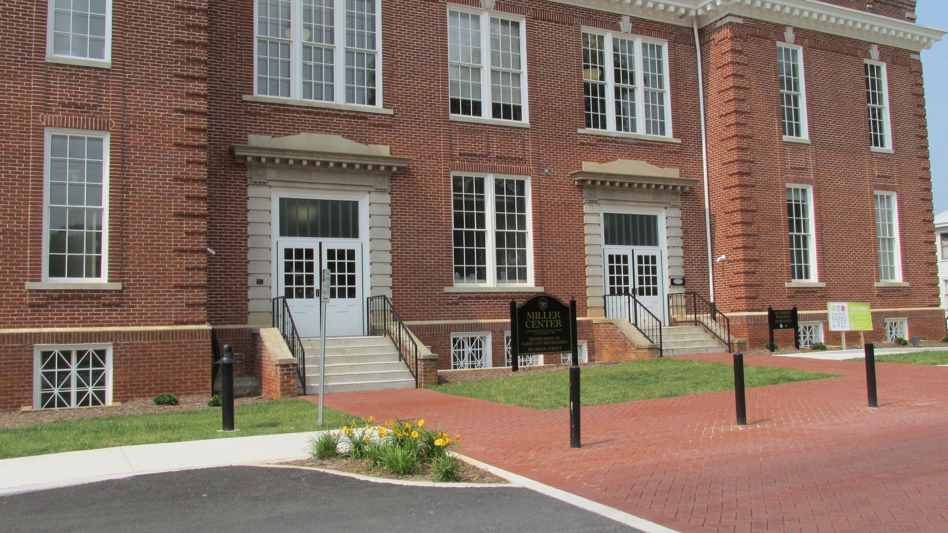 A large brick building with stairs leading up to it