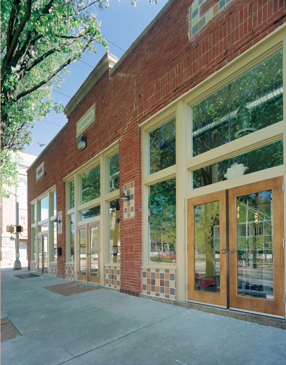 A brick building with a lot of windows and doors