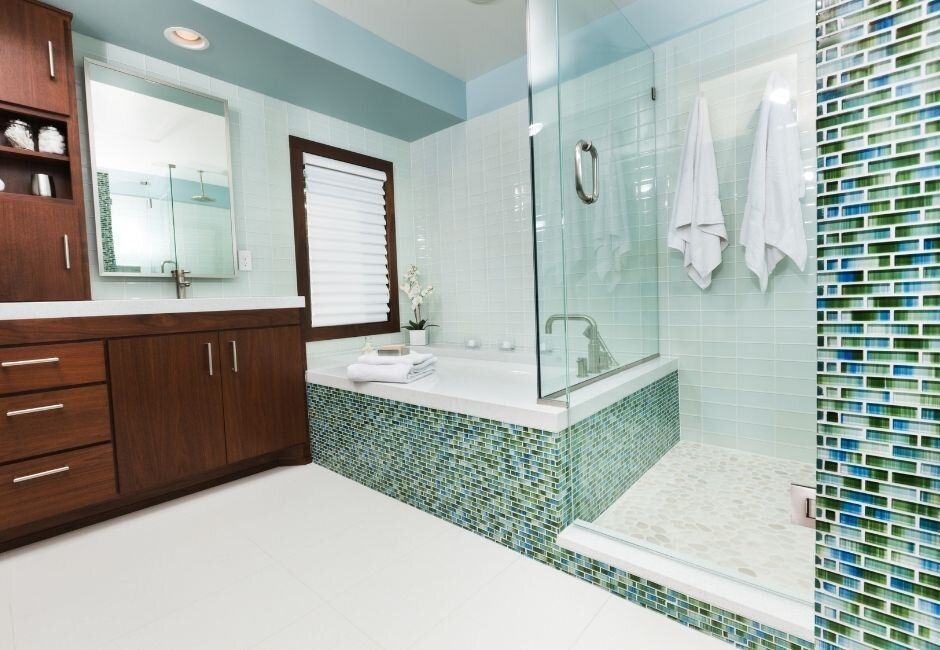 A bathroom with a bathtub and a walk in shower