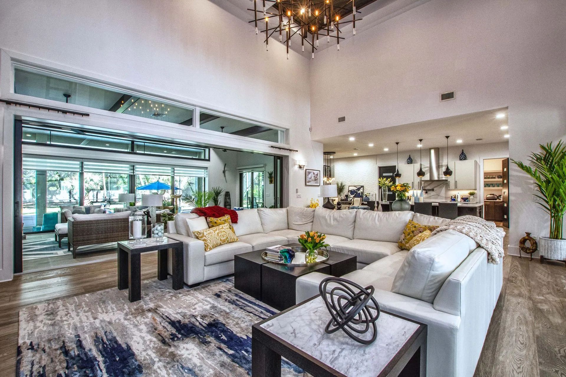 A living room filled with furniture and a chandelier.
