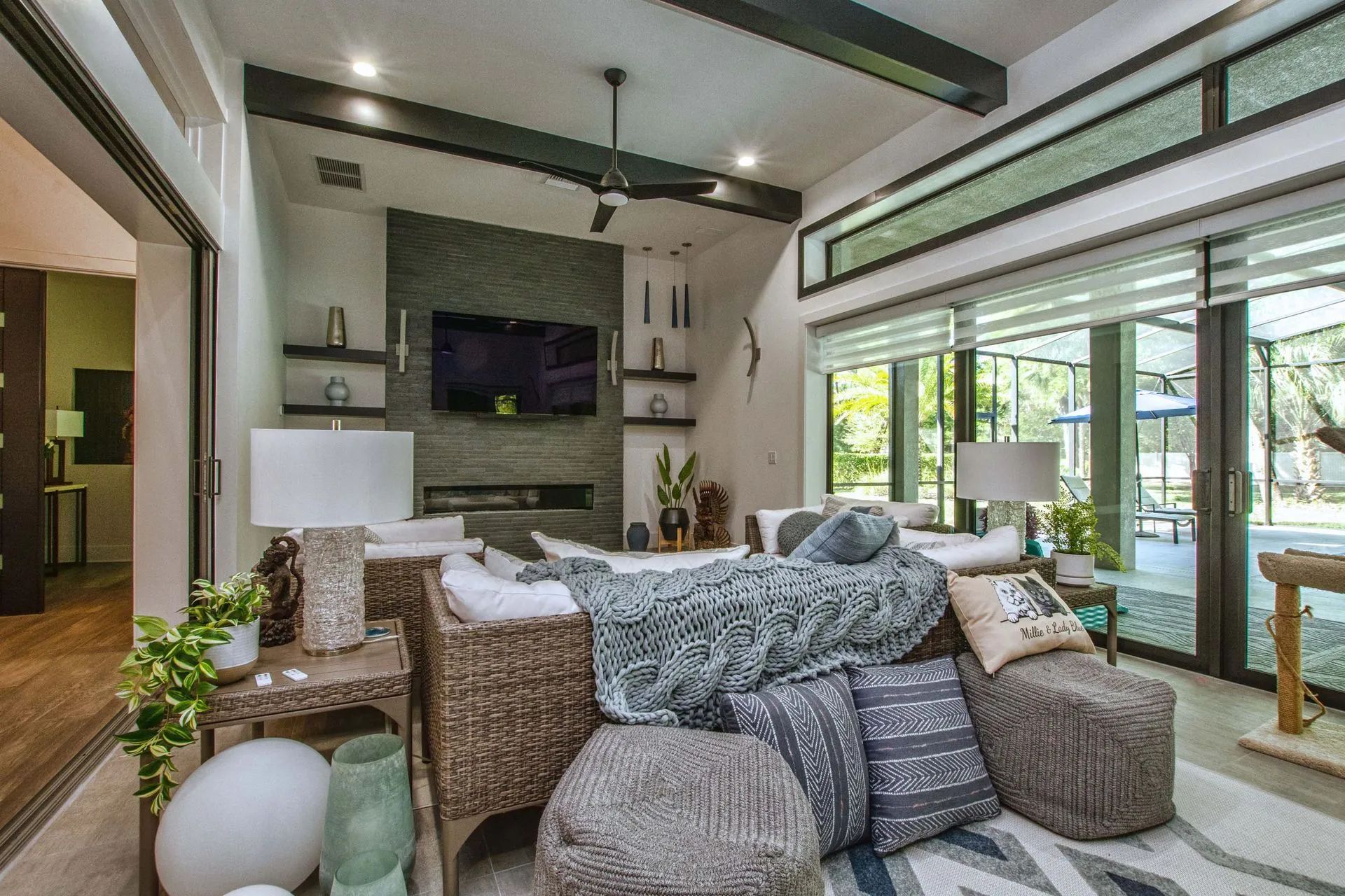 A living room filled with furniture and a flat screen tv.