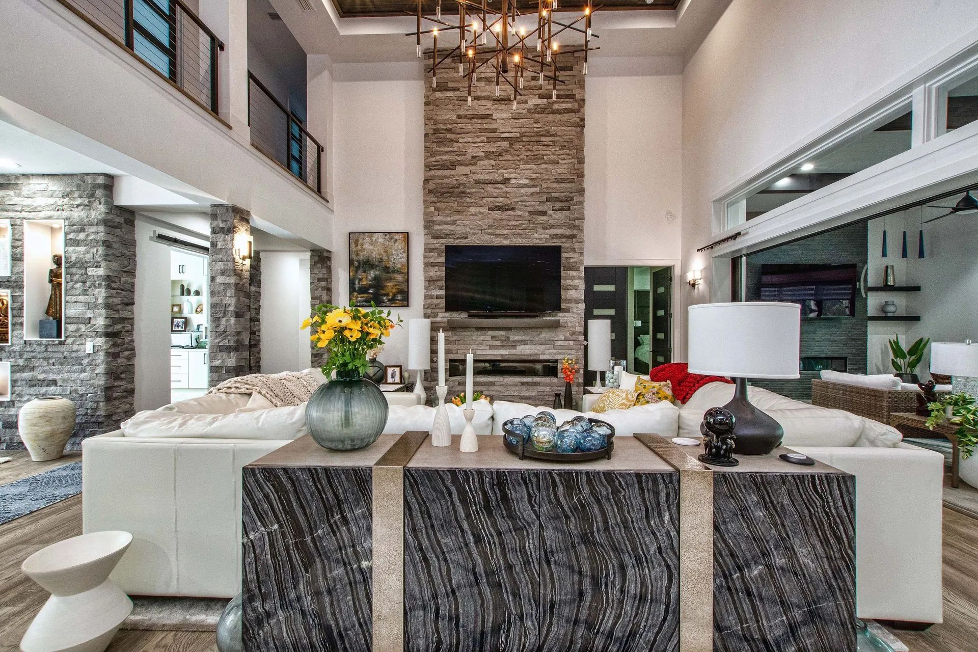 A living room filled with furniture and a television.