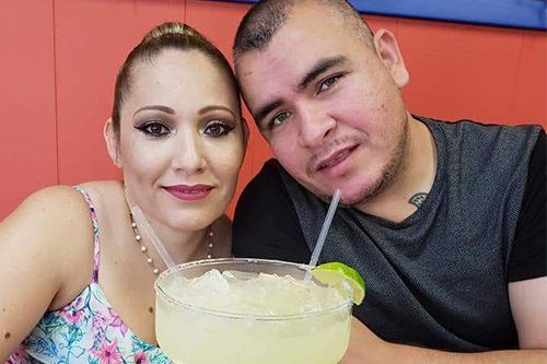 happy couple drinking margarita