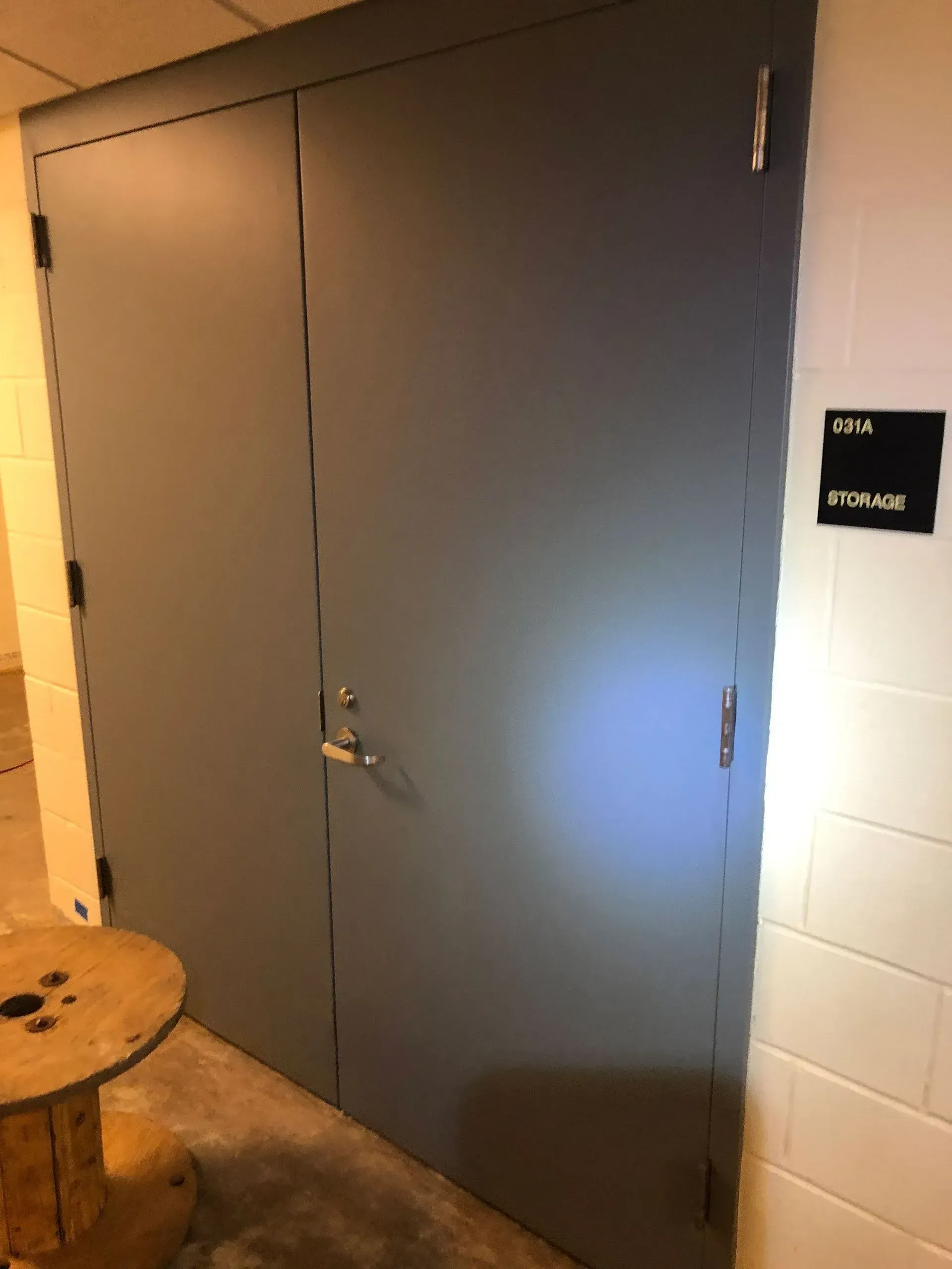 Gray double doors labeled 