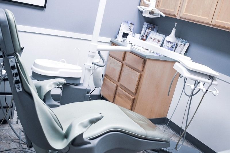 An empty dental chair in a dental office
