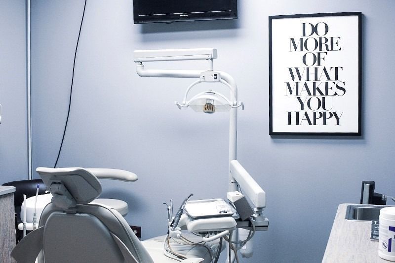 A dental office with a sign that says do more of what makes you happy