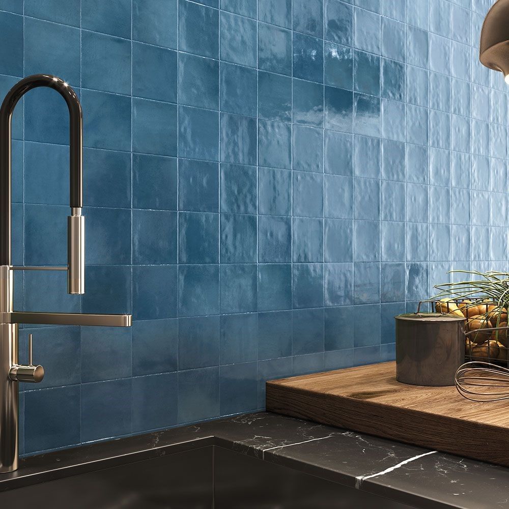 An empty room with a door open and a sink.