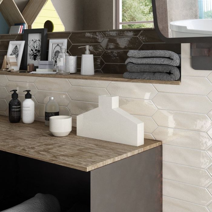 A bathroom counter with soaps and towels on it
