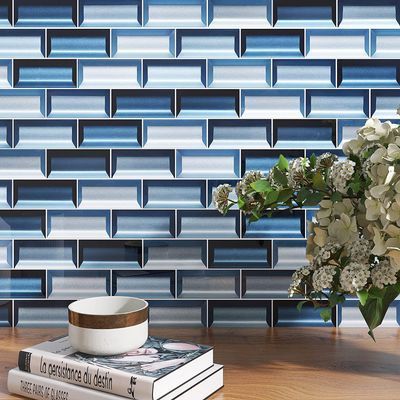 A vase of flowers is sitting on a table next to a bowl and a book.