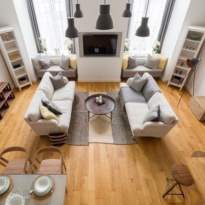 An aerial view of a living room filled with furniture and a flat screen tv.