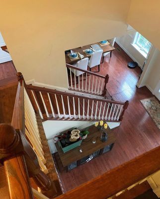 An aerial view of a house with stairs leading up to the second floor.