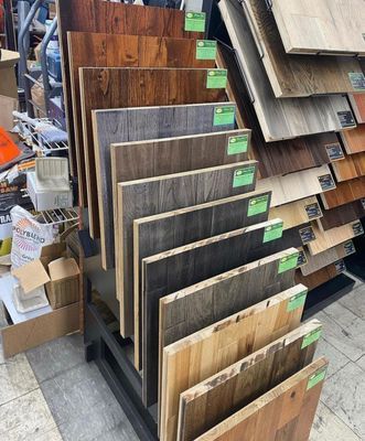A display of different types of wooden flooring in a store.