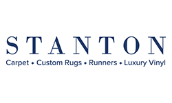 The logo for stanton carpet , custom rugs , runners , and luxury vinyl.