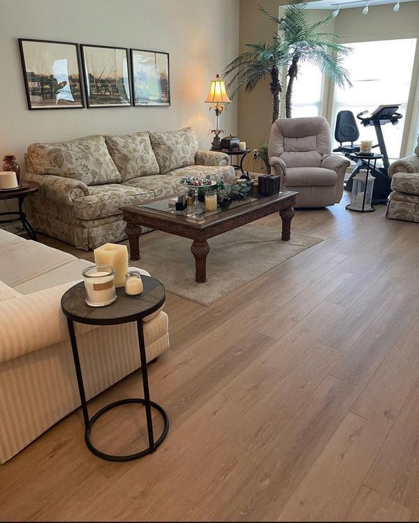 A living room with a couch a chair and a coffee table