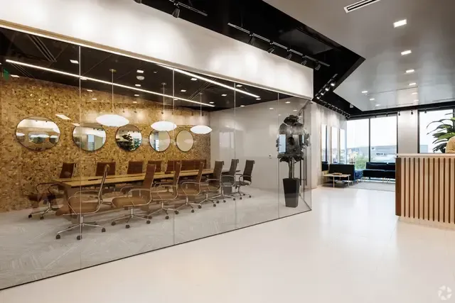 An artist 's impression of a conference room in an office building.