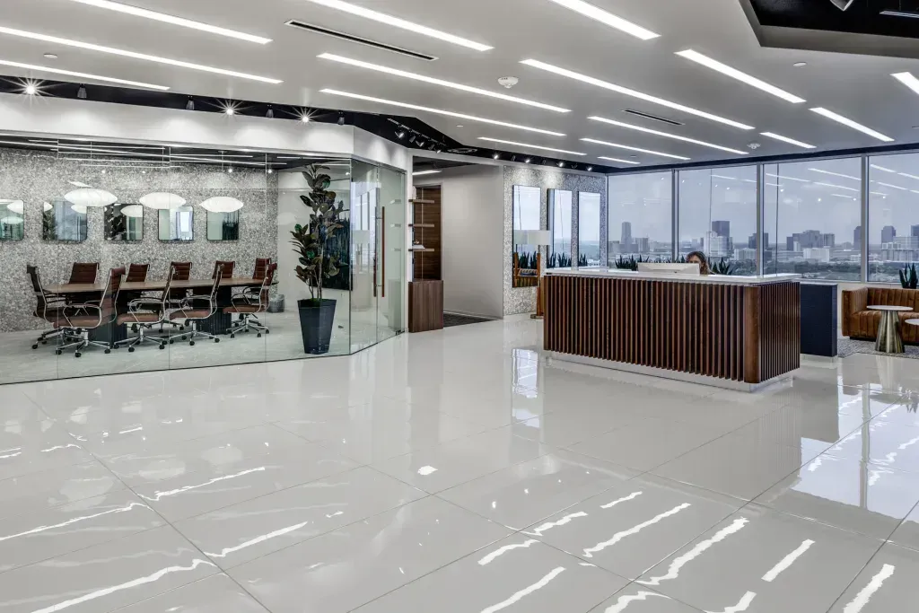 A large office building with a reception desk and a conference room.