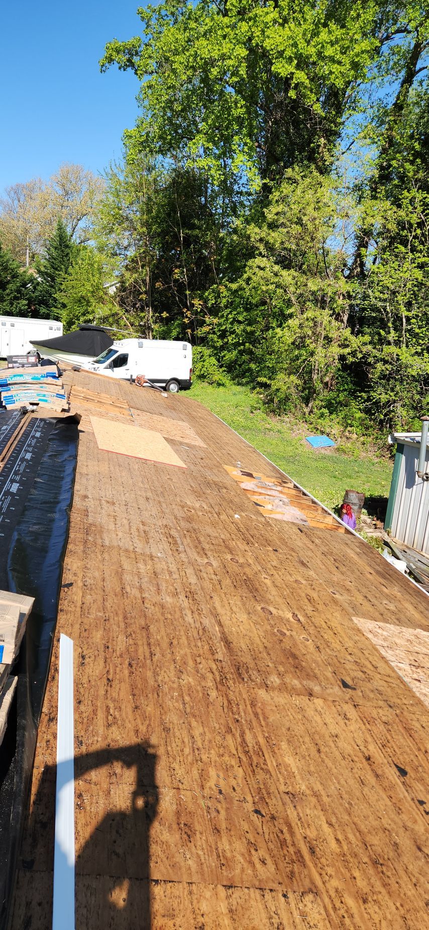 A wooden roof is being installed on a house.
