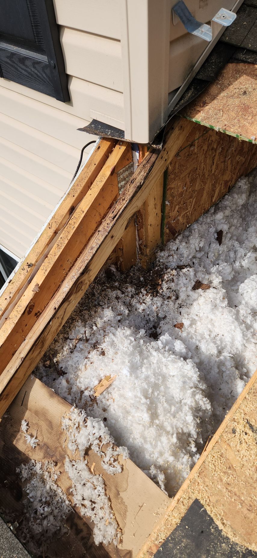 A close up of a hole in the roof of a house.