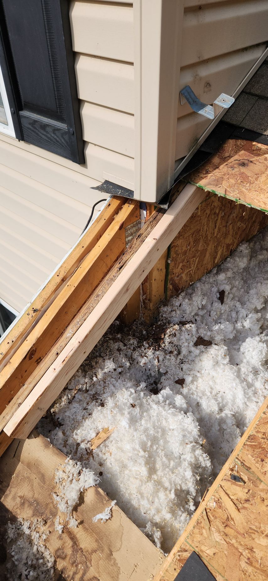 A house is being built with a lot of wood and styrofoam.