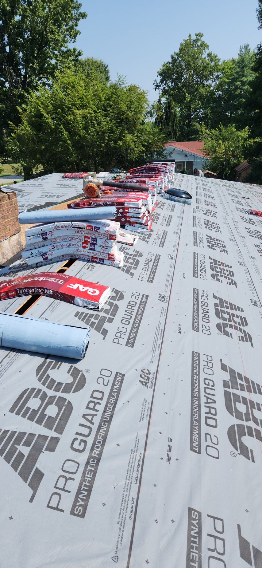 A roof with a lot of roofing material on it.