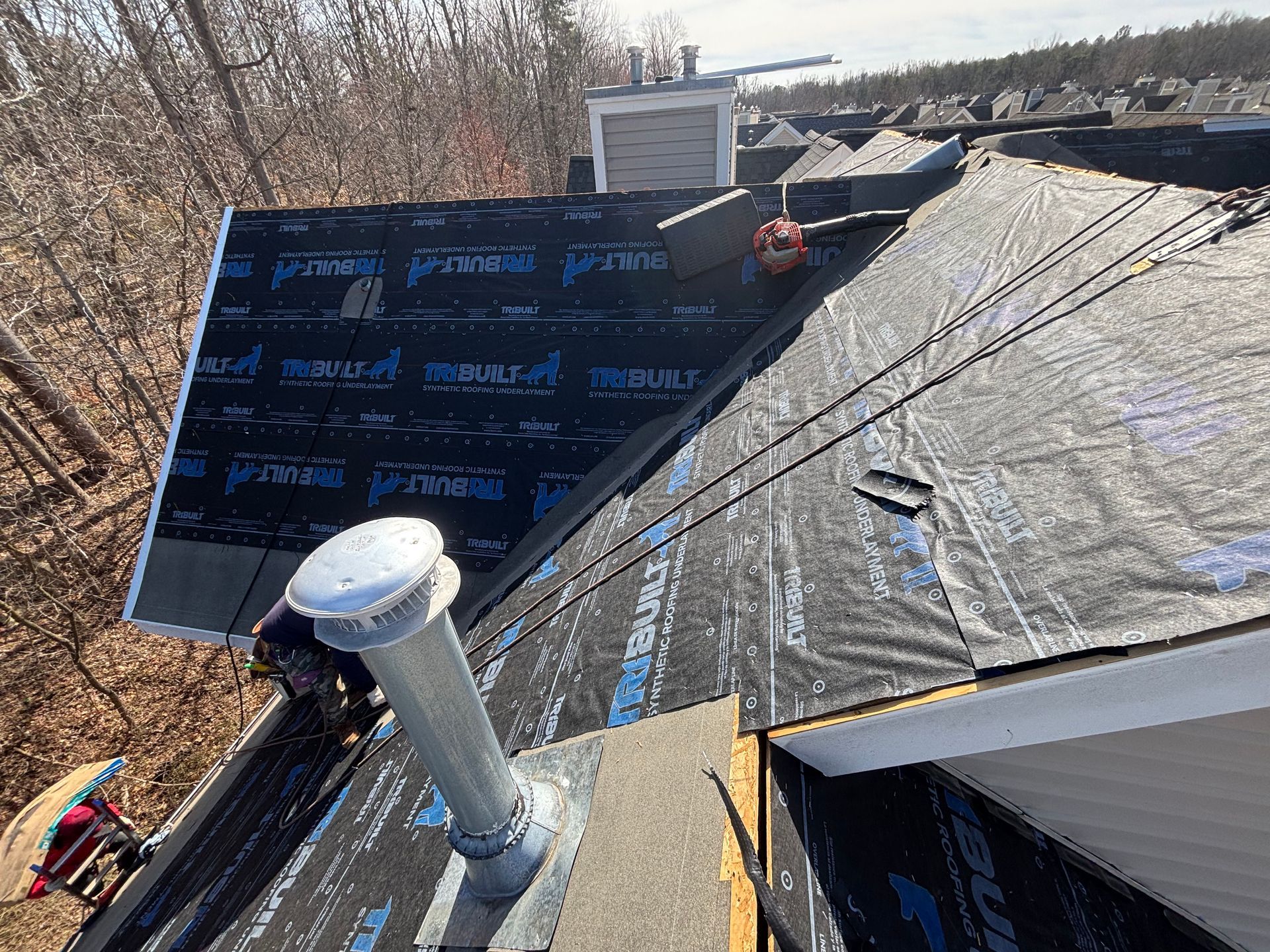 A roof is being installed on a house.