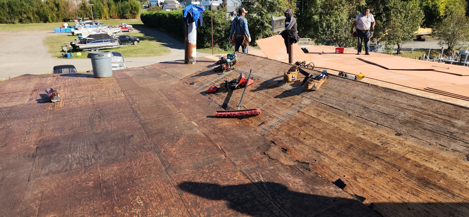 A group of people are working on a roof.