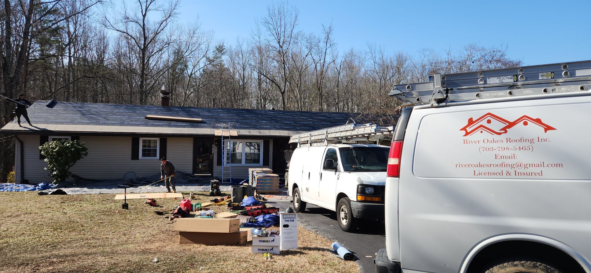 A white van is parked in front of a house.