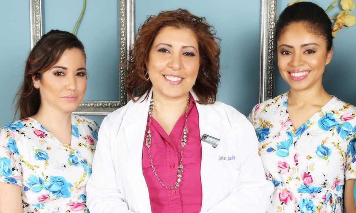 A group of three women are posing for a picture.