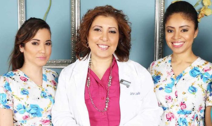A group of three women are posing for a picture.