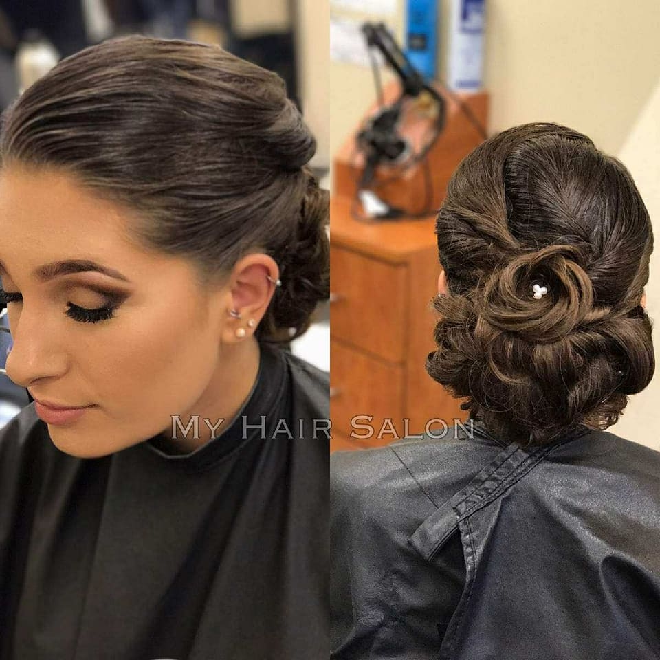 A woman is getting her hair done at my hair salon