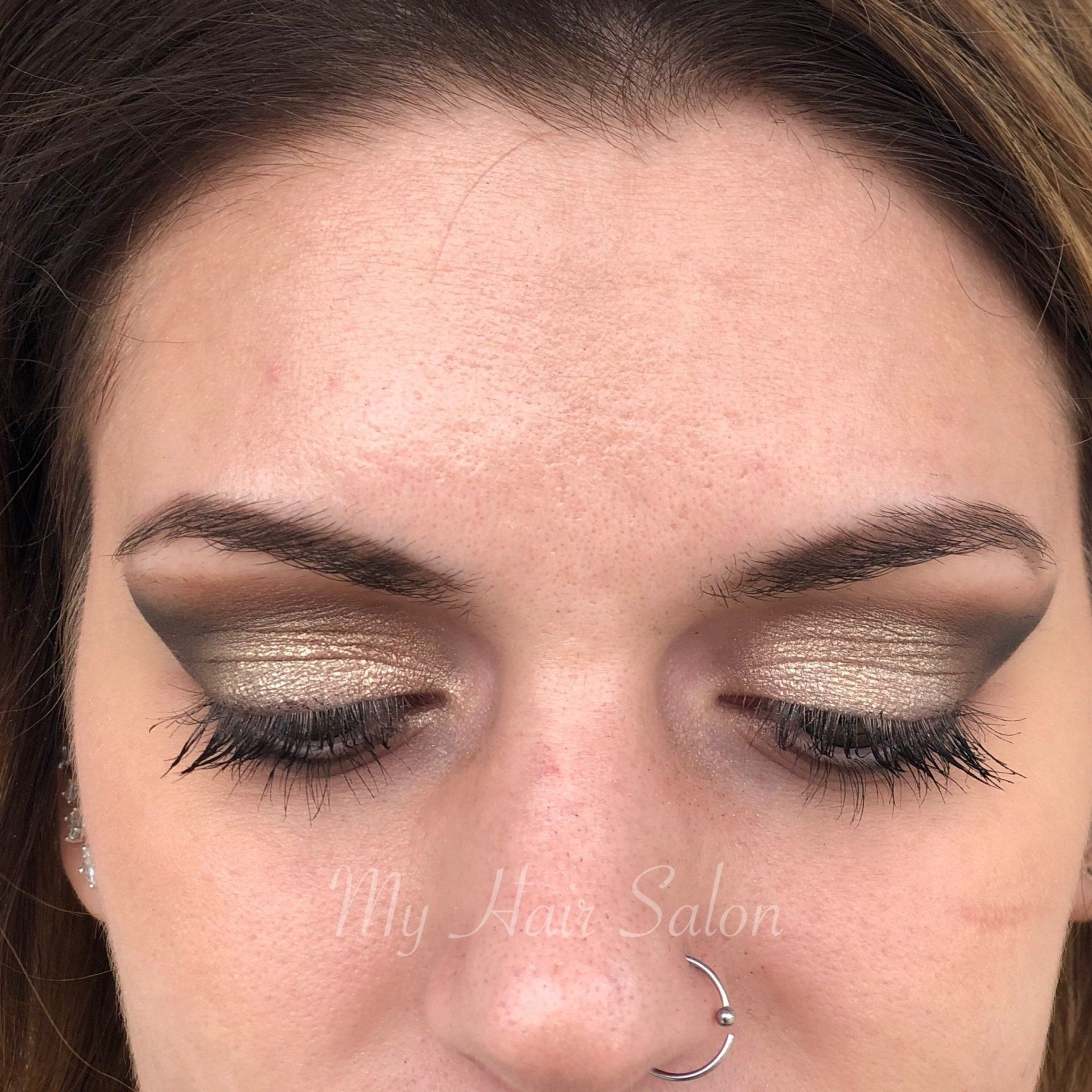 A close up of a woman 's face with the words my hair salon on the bottom