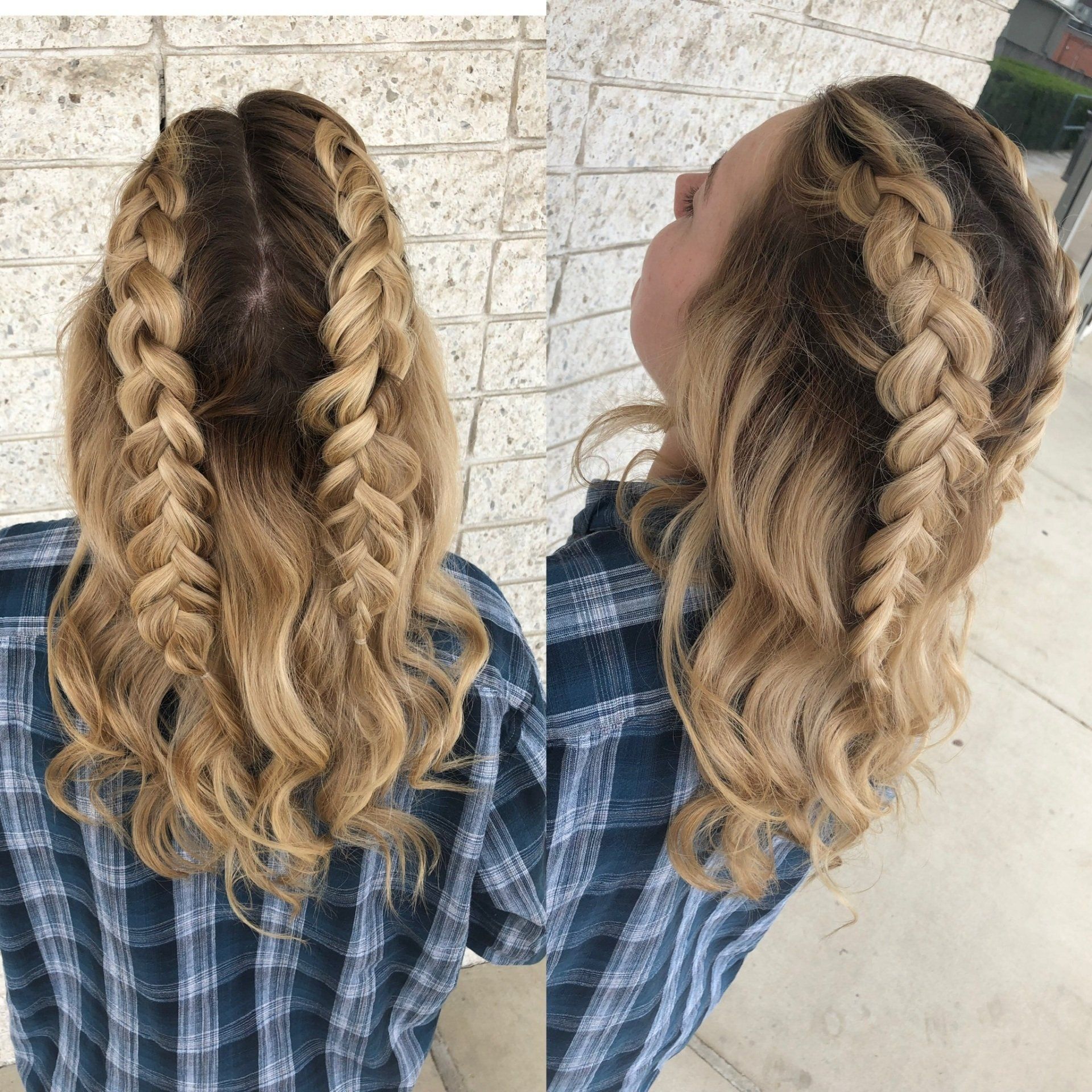 A woman wearing a plaid shirt has a braid in her hair.