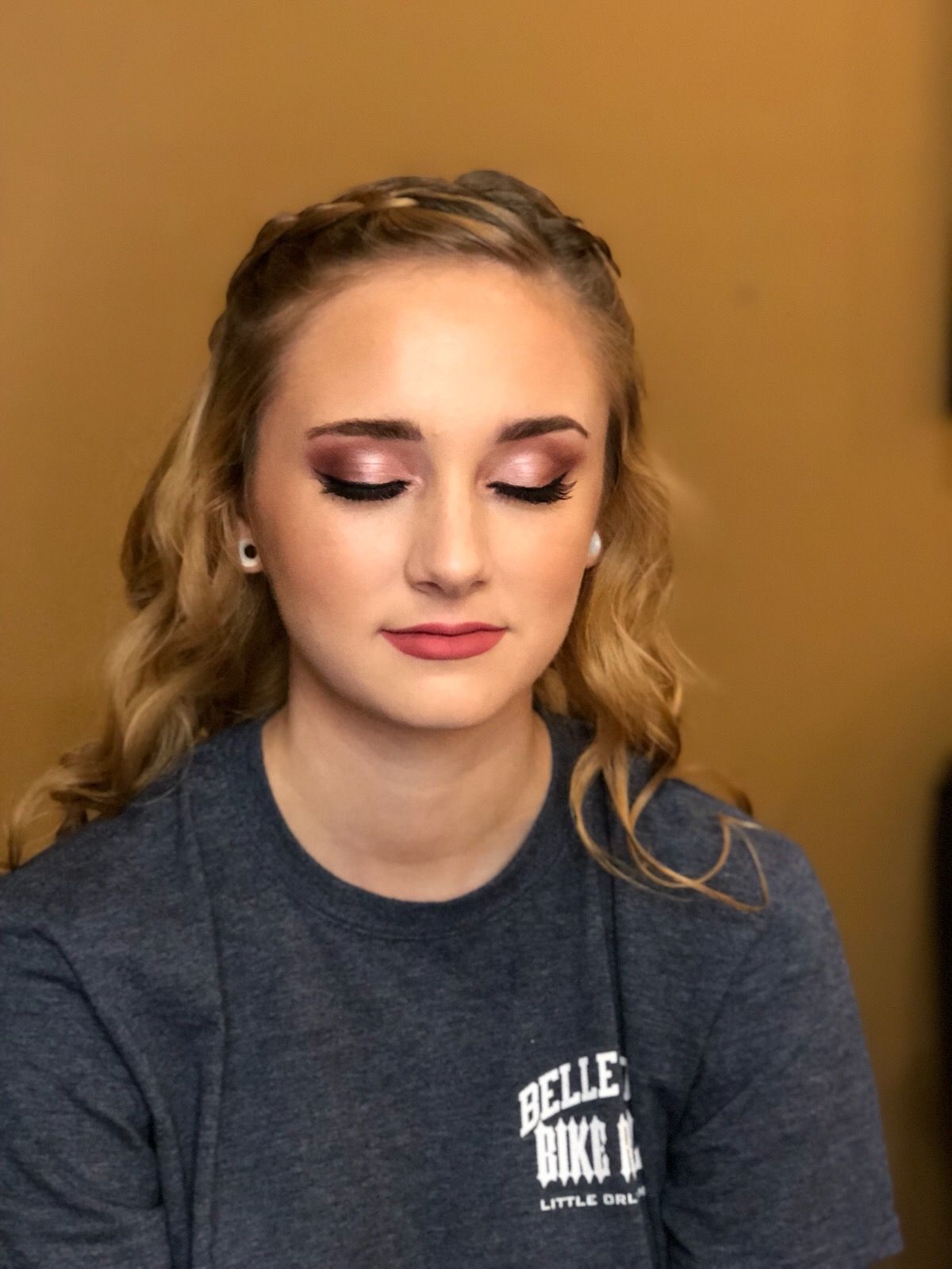A woman wearing a t-shirt with the word belle on it