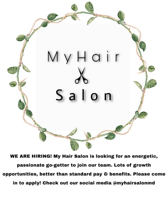 A poster for a hair salon with a wreath of leaves and scissors.