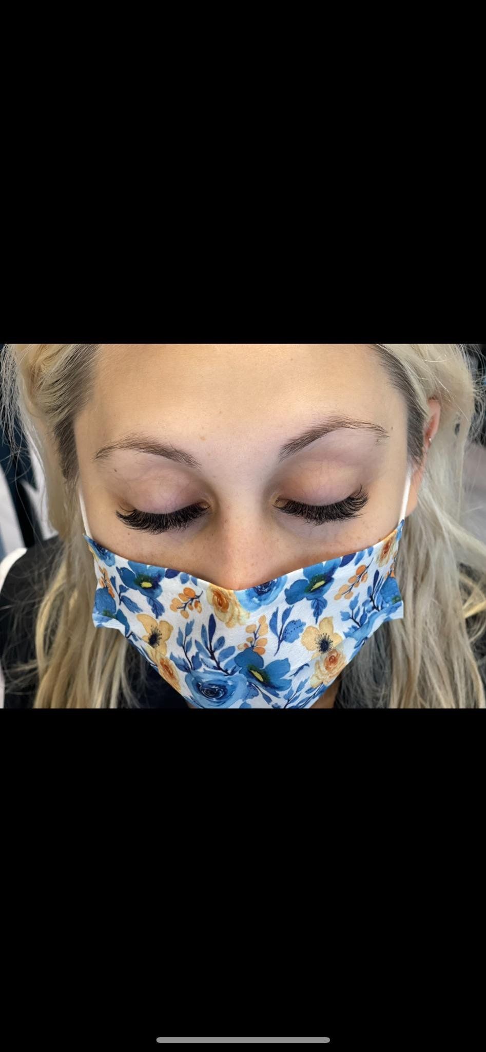 woman on facial mask after lashes extensions