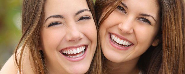 Two women friends laughing