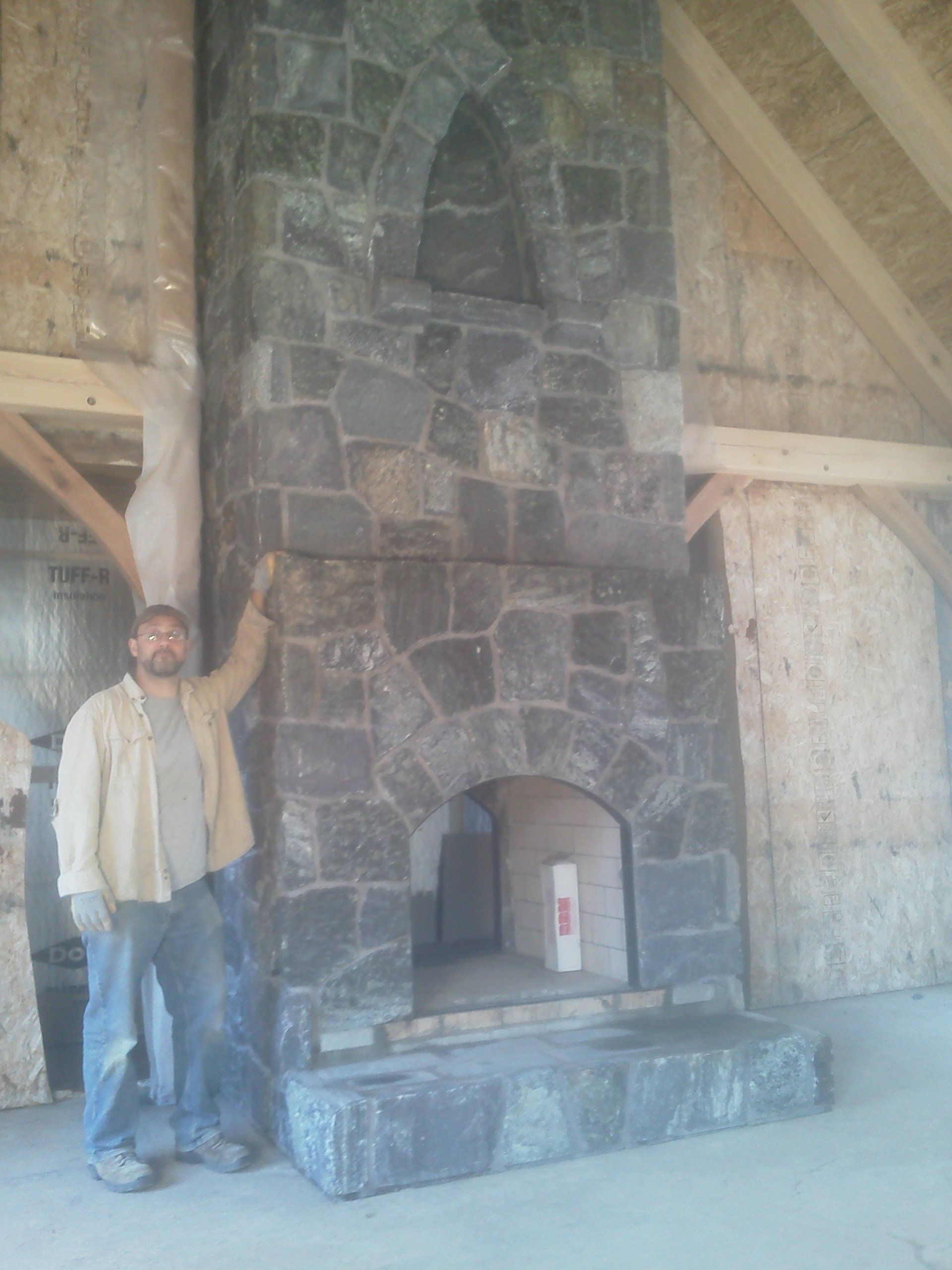 man by the fireplace