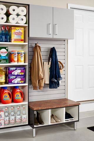 Garage organization: Shelf with supplies, coats on a slat wall, bench with shoe storage.