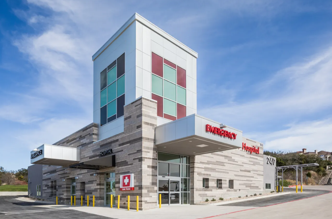 A large building with a red cross on the side of it.