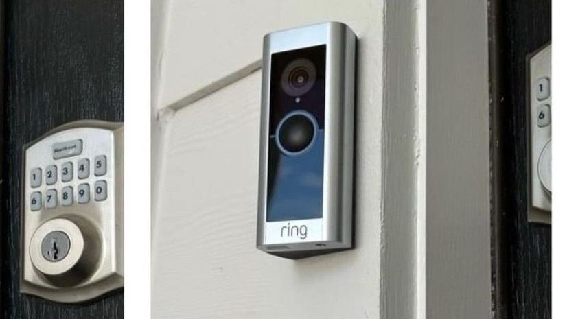 A ring doorbell is mounted on the side of a door.