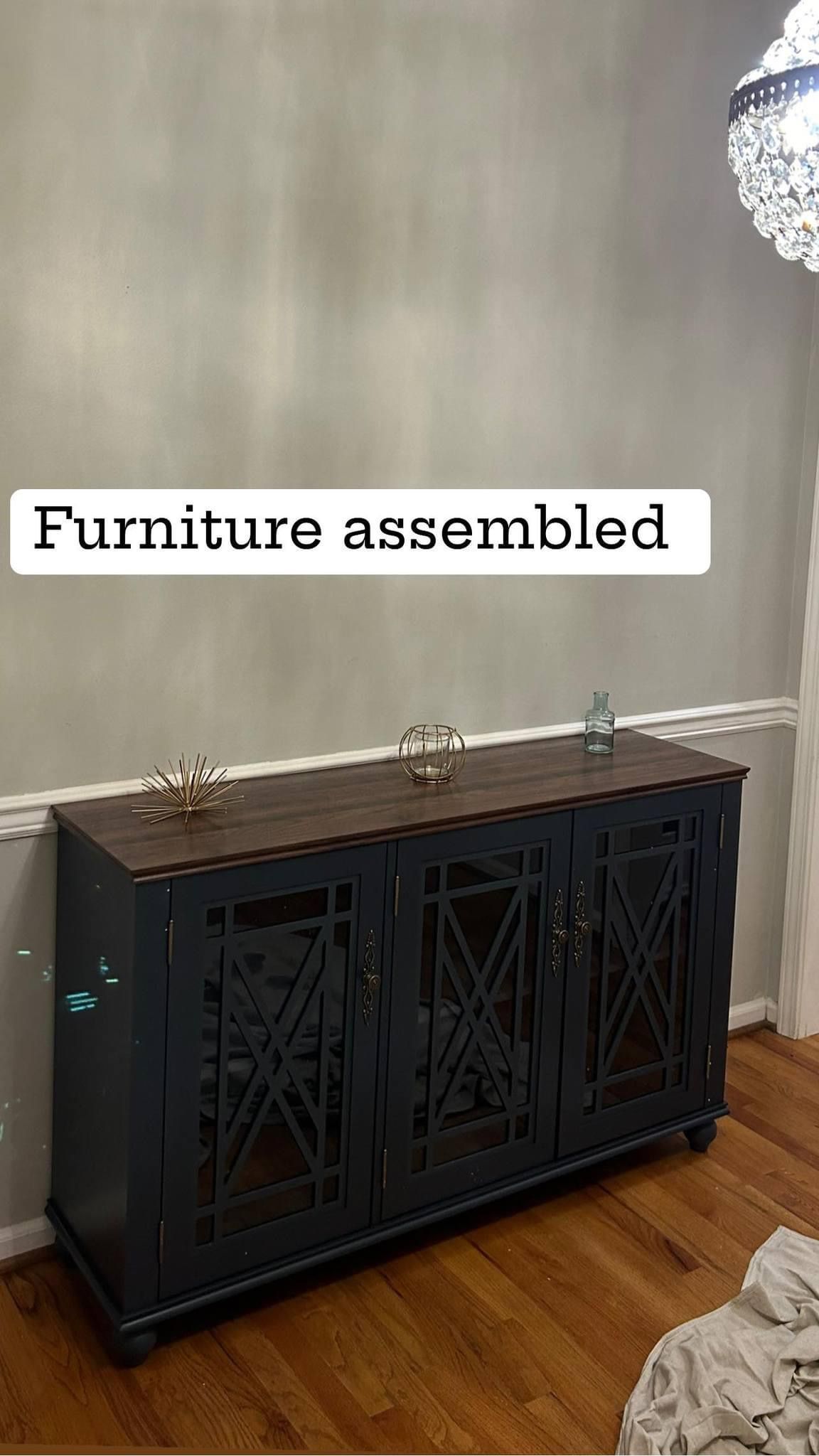 A blue dresser is sitting in a living room next to a wall.