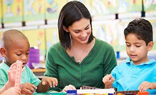 Teacher teaching children