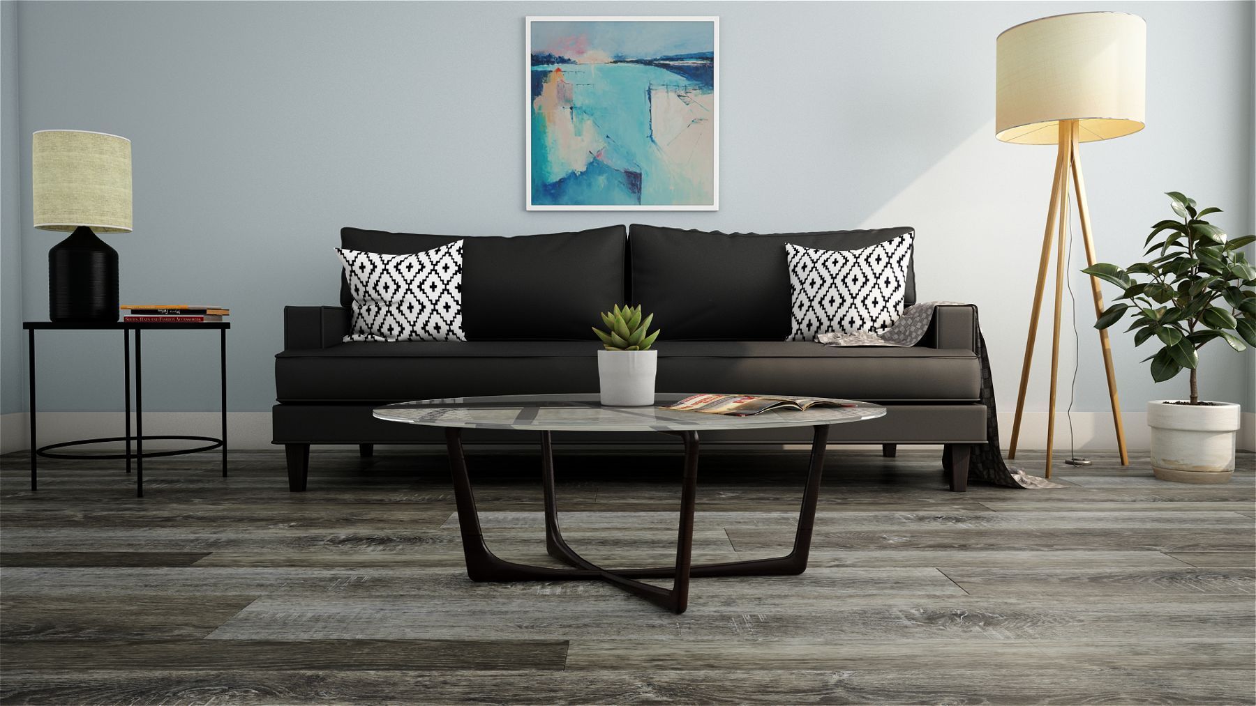 A living room with a black couch and a coffee table.