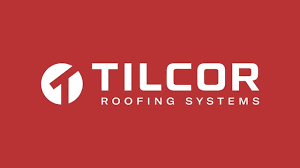 The tilcor roofing systems logo is on a red background.
